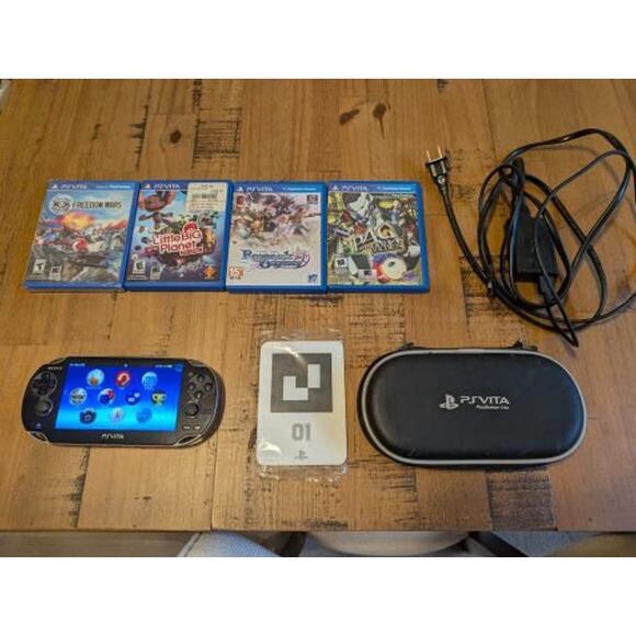 PlayStation Vita (1st Gen) + 4 Games and Case - Picture 1 of 9